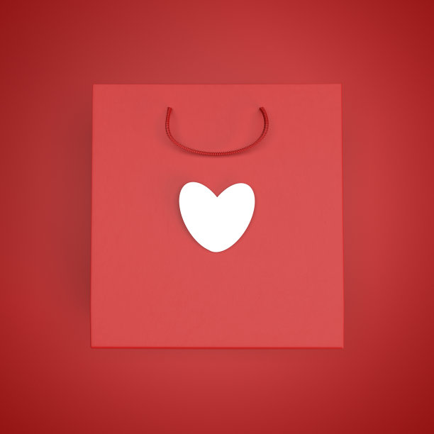 红色纸袋上有白色的心在红色的背景。俯视图，布局设计图片下载
