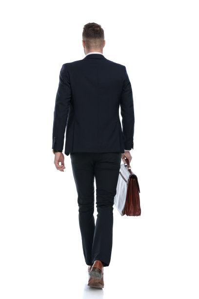 后视图的商人拿着公文包和行走图片下载
