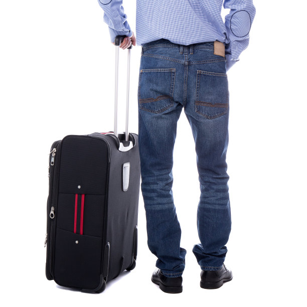 后视图的商人站在孤立的手提箱上白色图片下载