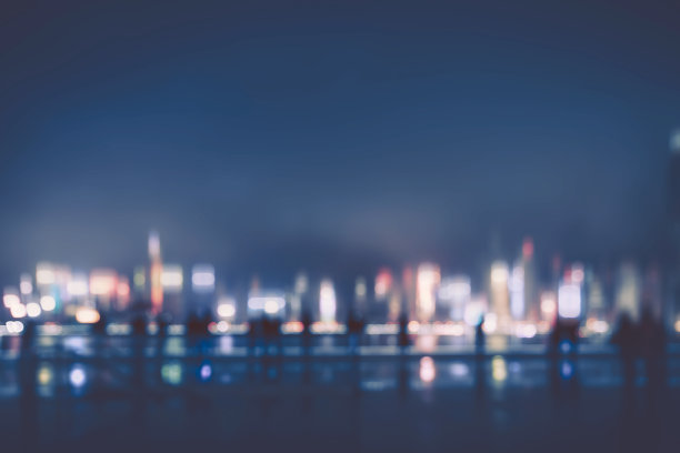 抽象的以城市为背景的彩色圆形散景图片下载