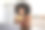 一个女人拿着咖啡杯在厨房看她的笔记本电脑图片下载