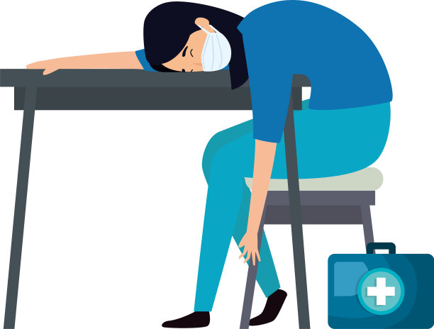 女医护人员戴着面罩睡在桌子上图片下载