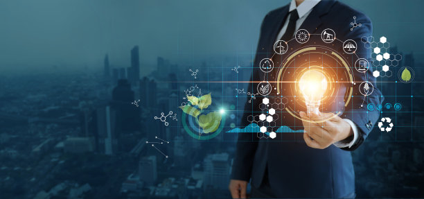 商人拿着灯泡，以城市为背景，象征着能源的可再生，可持续发展，生态和可再生能源的概念。图片下载