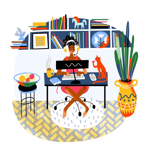 戴着耳机和猫一起在电脑前工作的女人图片下载