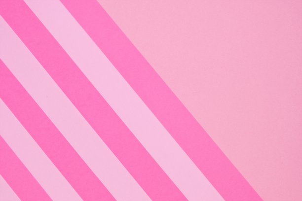 粉色条纹纸背景。条纹的几何背景。论文文摘纹理。包装纸。阻塞的背景颜色。明亮的粉红色条纹棒棒糖背景图片下载