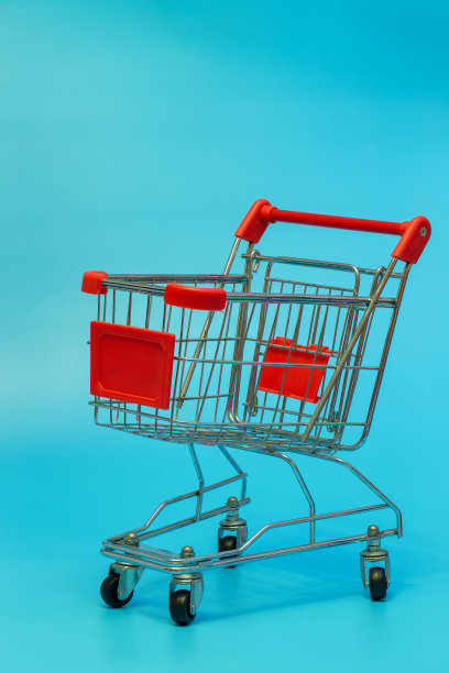 空购物车孤立的蓝色背景图片下载