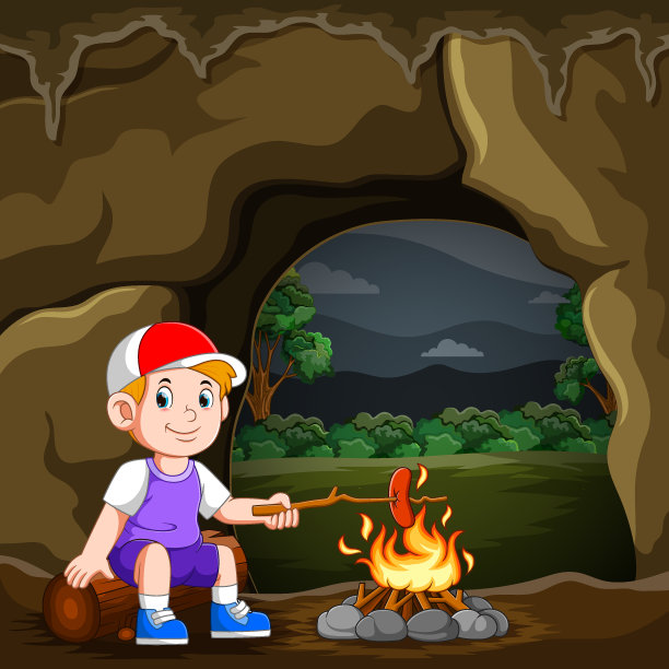 这个男孩正在露营和烧香肠图片下载