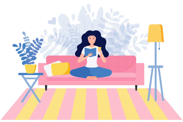 一个年轻女子坐在瑜珈上看书图片下载