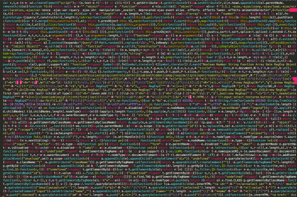 数字屏幕与编译的JavaScript代码。在笔记本电脑上编写代码。图片下载