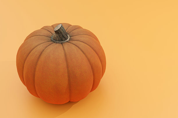 橙色背景下分离的南瓜图片下载