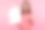 快乐微笑的女人棕色头发在粉红色毛衣指着手指在她的手，看着相机，建筑机构图片下载