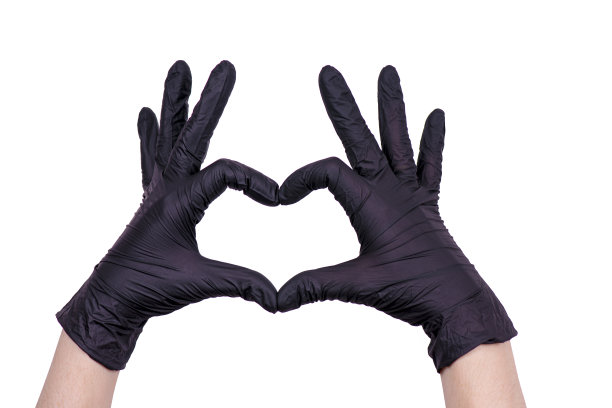 女人的手戴着手套。医学的主题。冠状病毒大流行图片下载