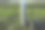 特写的不锈钢热水瓶和绿色草地上的两个杯子。图片下载