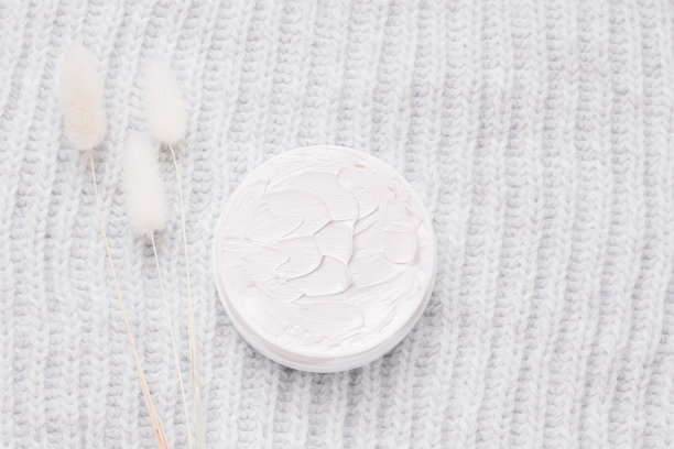 冬季护肤霜上灰色，针织纹理，俯视图图片下载