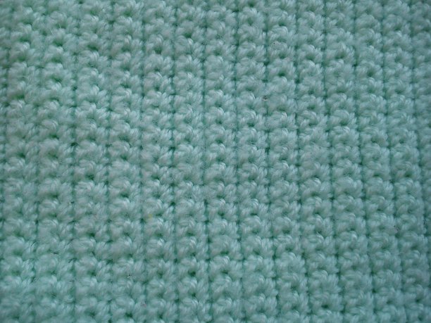 用绿松石腈纶纱编织的碎片图片下载