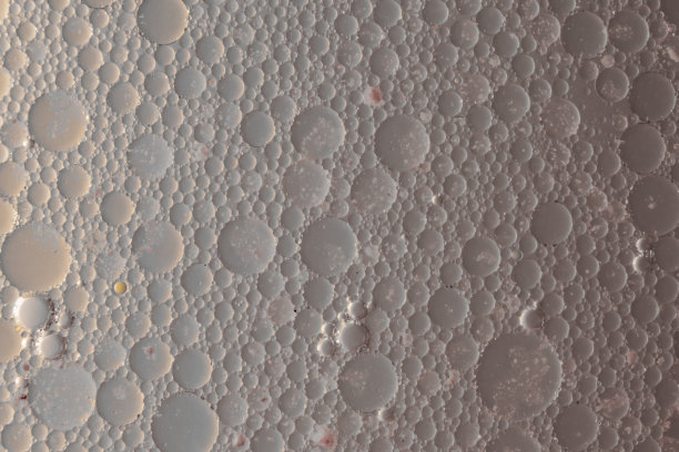 污染的液体。粒子、气泡和流体的系列照片。抽象的背景。图片下载