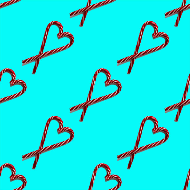无缝心形图案与圣诞糖果在一个蓝色的背景，俯视图图片下载