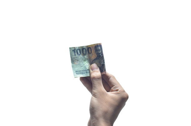 在孤立的白色背景上，右手握着印尼货币图片下载