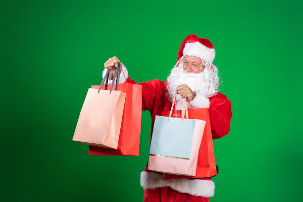 圣诞老人拿着购物袋的照片图片下载