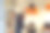 一个披着黑斗篷戴着女巫帽的男孩用胶水把纸棒粘在墙上。女孩帮助她的弟弟，给了他一个球棒。图片下载