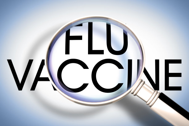 流感疫苗文字-透过放大镜看到的概念图像图片下载