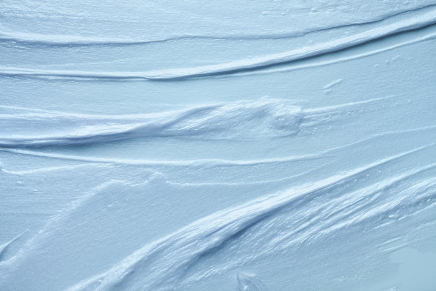 化妆品浅蓝灰色丝滑奶油牛奶质地在白色的背景图片下载