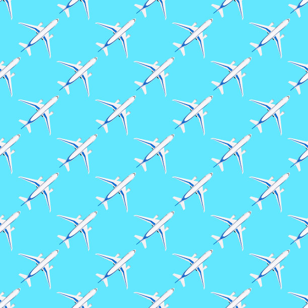 无缝模式与白色飞机上的蓝色背景。纸张、织物或墙纸重复印刷。玩具飞机。旅行和冒险的概念平坦lay图片下载