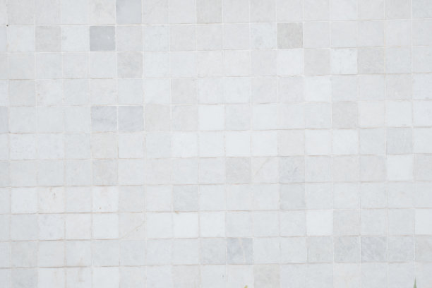 特写白墙瓷砖图案。以白色和灰色为背景的瓷砖图案。图片下载