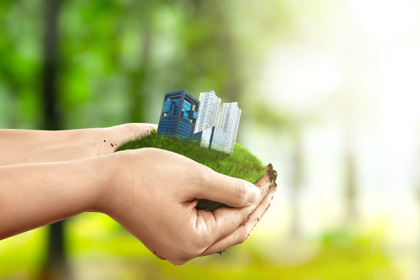 人类手握着土地的建筑和公寓图片下载