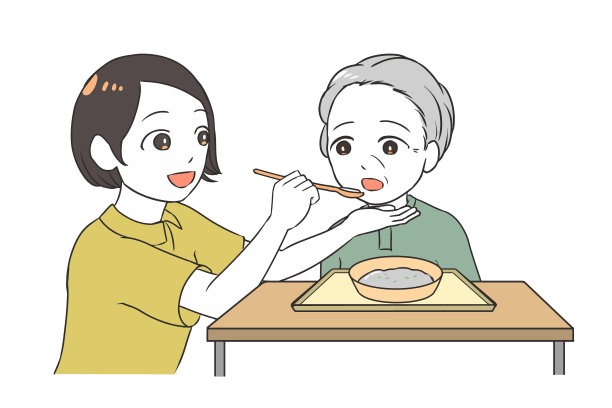 女性照顾者帮助老年妇女吃饭图片下载