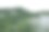 热带雨林中一座小山的鸟瞰图，许多云覆盖着绿色的树冠图片下载