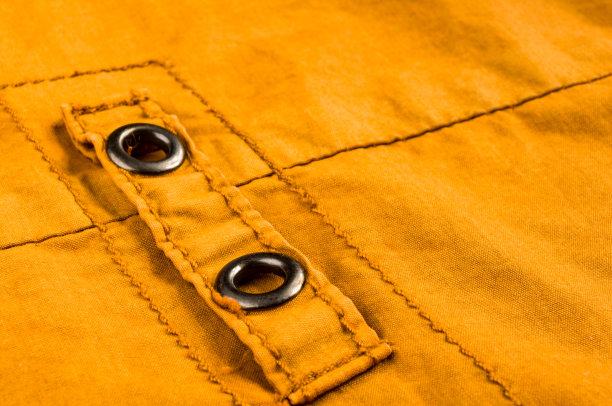 衣服项目石洗棉织物纹理接缝，扣，钮扣和铆钉，宏观图片下载