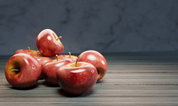 新鲜的红苹果被放在木桌面上，墙上是大理石图案。三维渲染图片下载