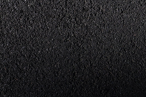 黑色橡胶沥青的质地。跑道和操场用橡胶盖结构。图片下载