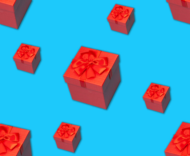 无缝图案的红色礼盒与缎带上的蓝色表面图片下载