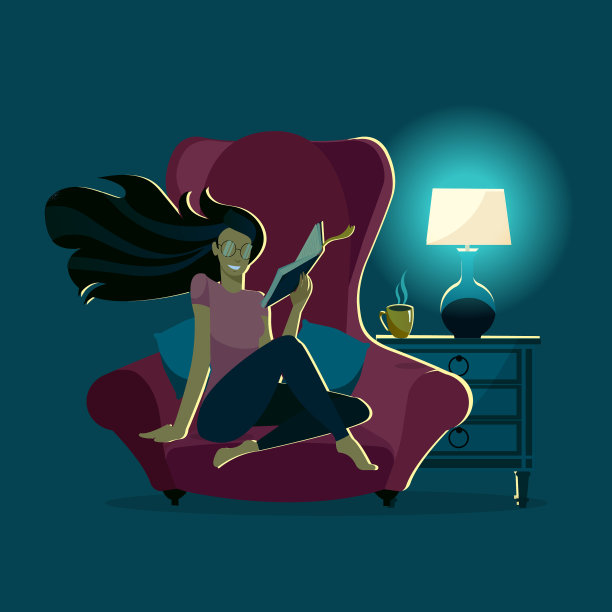 女孩晚上在舒适的扶手椅里看书图片下载