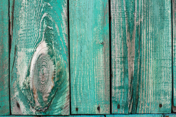 旧木板。木板上覆盖着绿色油漆的纹理。图片下载