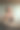 这是一名年轻的商务女性在办公室拿着咖啡杯打电话的照片。图片下载