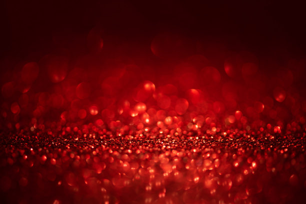 红色和黑色背景上的抽象闪烁灯。圣诞贺卡。圣诞节或新年庆祝概念。副本的空间。软焦点图片下载