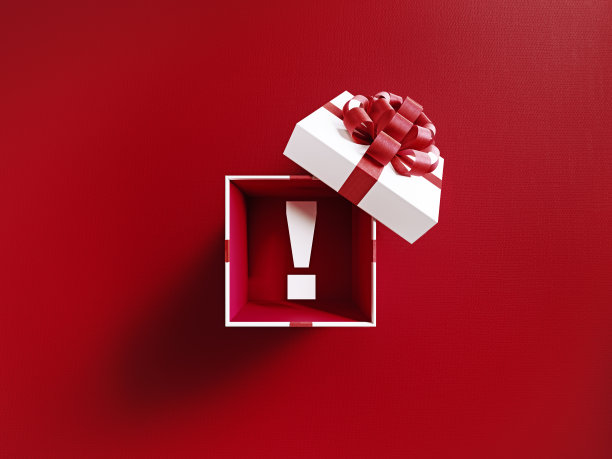 用红丝带系着的白色礼盒里的感叹号图片下载