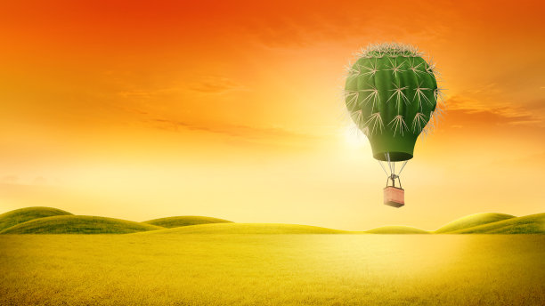 仙人掌形状的热气球，漂浮在绿色山丘上的热气球，以大自然和天空为背景，旅游旅游的概念图片下载