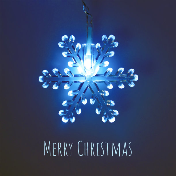 圣诞贺卡与圣诞雪花灯装饰在蓝色的背景图片下载