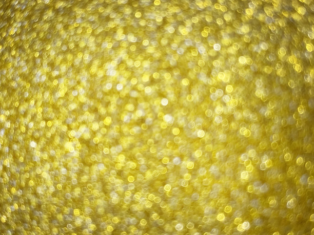 抽象纹理黄色多色模糊假日背景与散景，选择性聚焦。图片下载