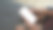 一个女人拿着手机的空白屏幕坐在沙发上的模型图像。图片下载