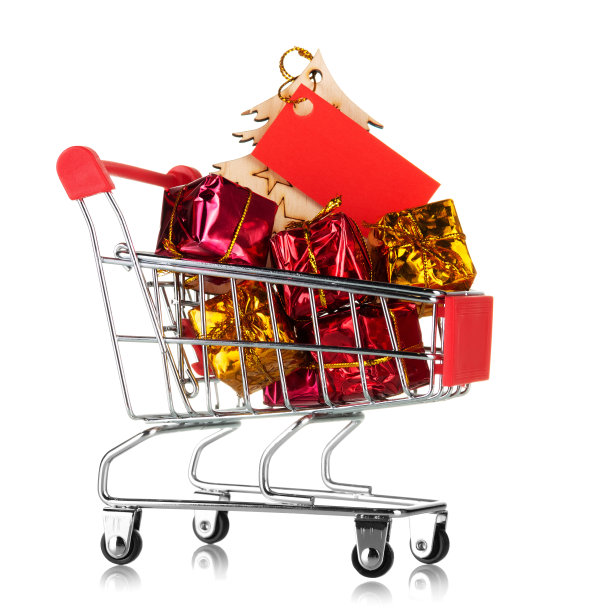 新年购物的概念。购物车装满了五颜六色的礼物孤立在白色图片下载