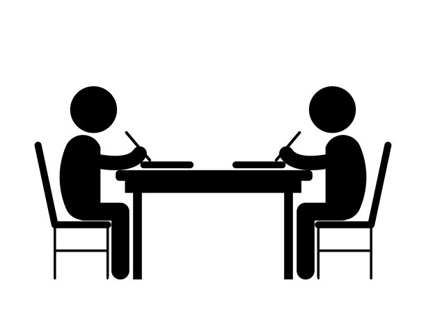 两个学生在书桌对面学习写作图片下载