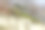 一个女孩坐在山上的小山丘上欣赏美丽的景色图片下载