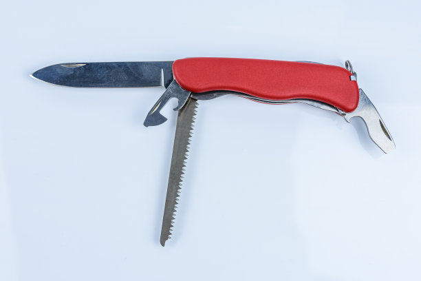 展开所有用途的红色口袋刀孤立在白色背景图片下载