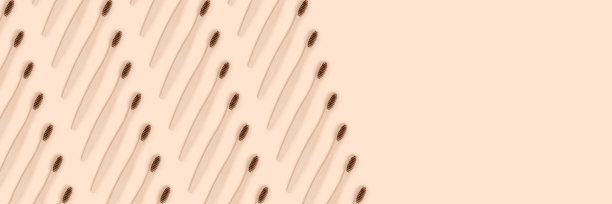 米色背景上有牙刷图案的横幅。图片下载