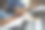 在工作桌上，女性手里拿着笔和日记本，旁边放着笔记本电脑。图片下载